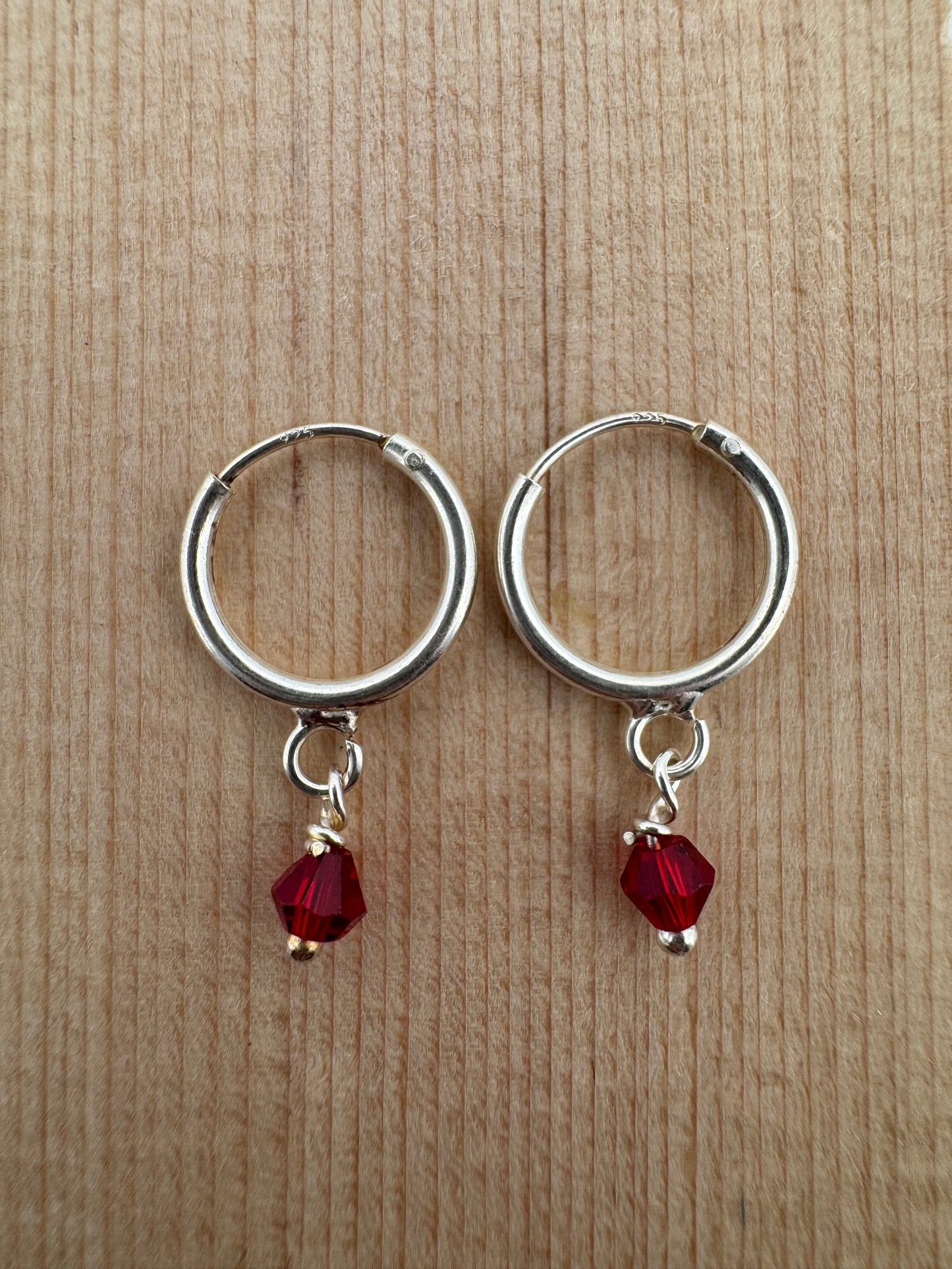 - "Handmade Hoop Earrings"
- "Ruby Crystal Jewelry"
- "Austrian Crystal Earrings"
- "Sterling Silver Jewelry"
- "Women's Hoop Earrings"