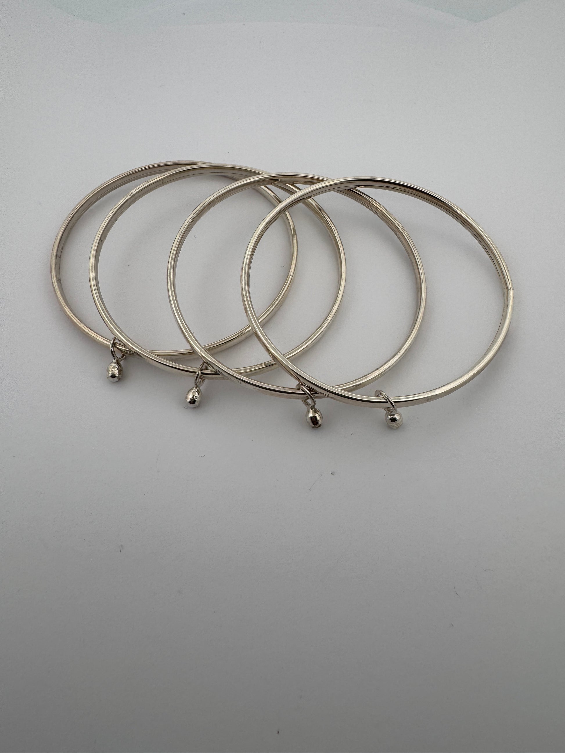 1. Sterling Silver Bangle with Soundless Anklets
2. Hinge Bangle Design
3. 925 Silver Bangle with Gumgarao
4. Elegant Hinge Bangle
5. Traditional Indian Bangle