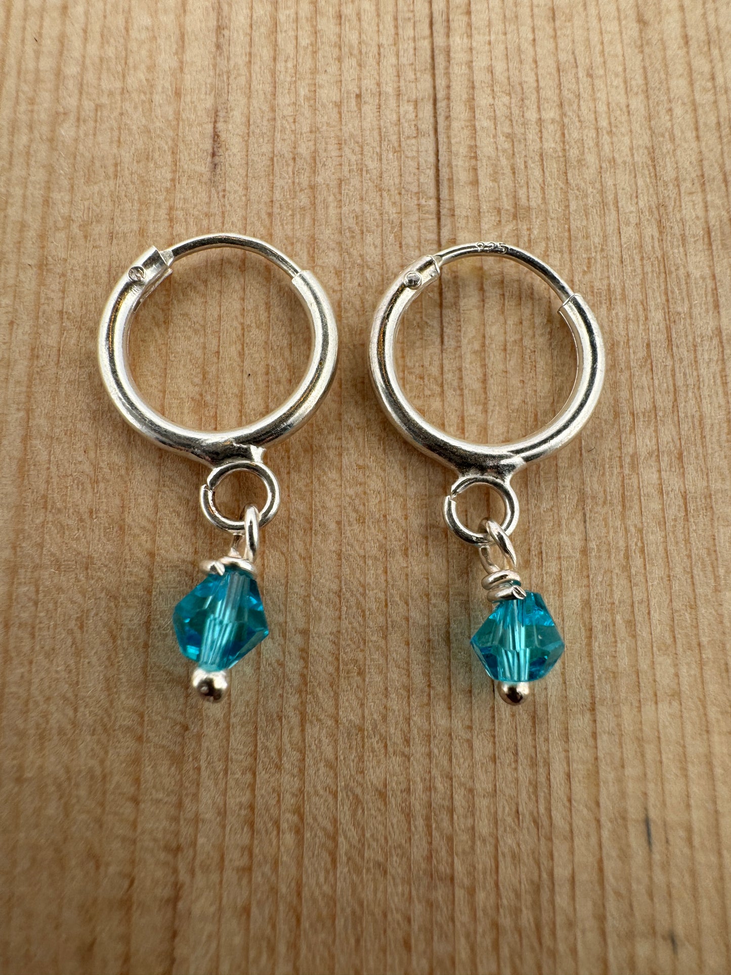- "Handmade Hoop Earrings"
- "Austrian Crystal Jewelry"
- "Light Blue Crystal Earrings"
- "Sterling Silver Jewelry"
- "Women's Hoop Earrings"