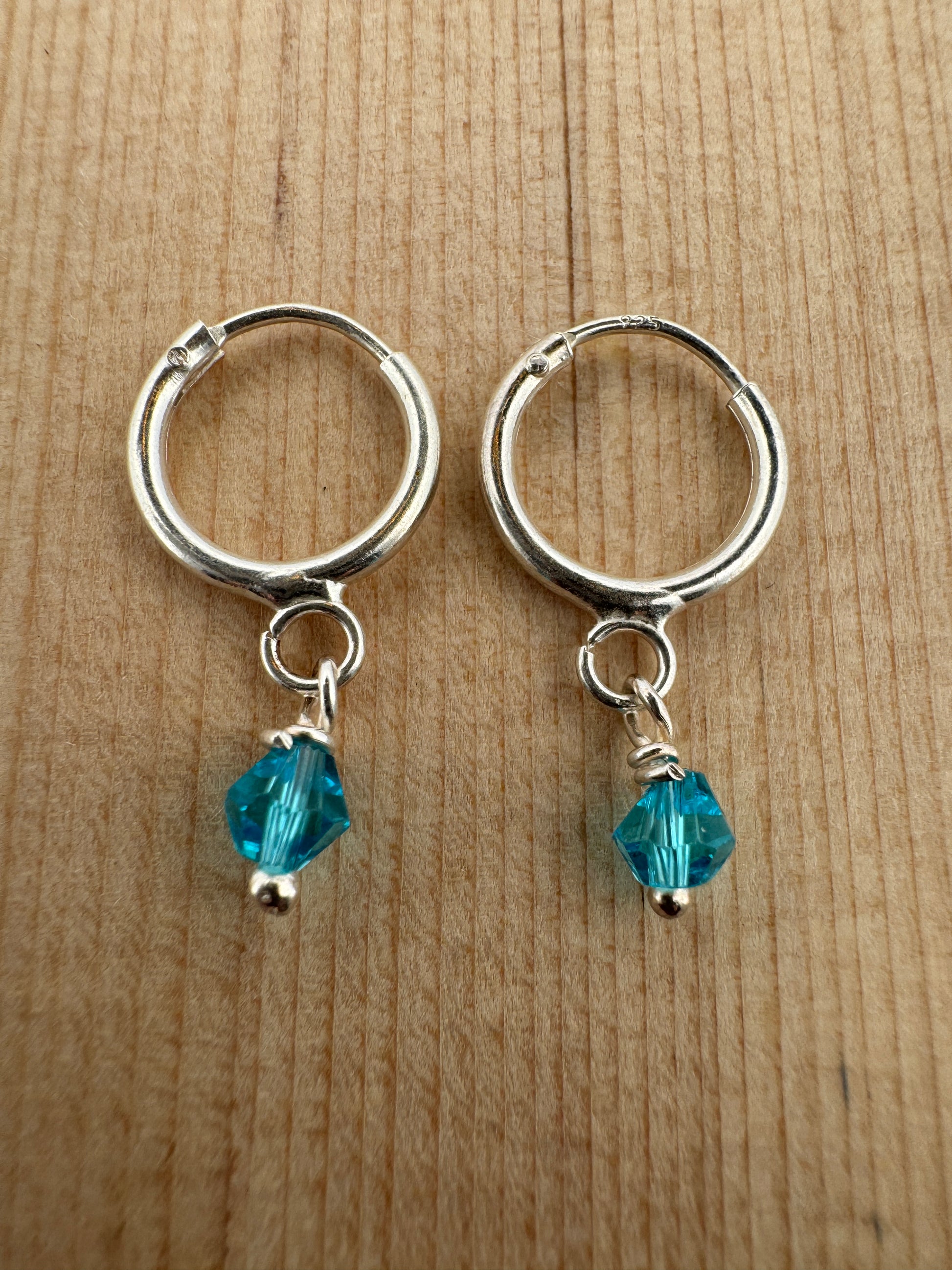 - "Handmade Hoop Earrings"
- "Austrian Crystal Jewelry"
- "Light Blue Crystal Earrings"
- "Sterling Silver Jewelry"
- "Women's Hoop Earrings"