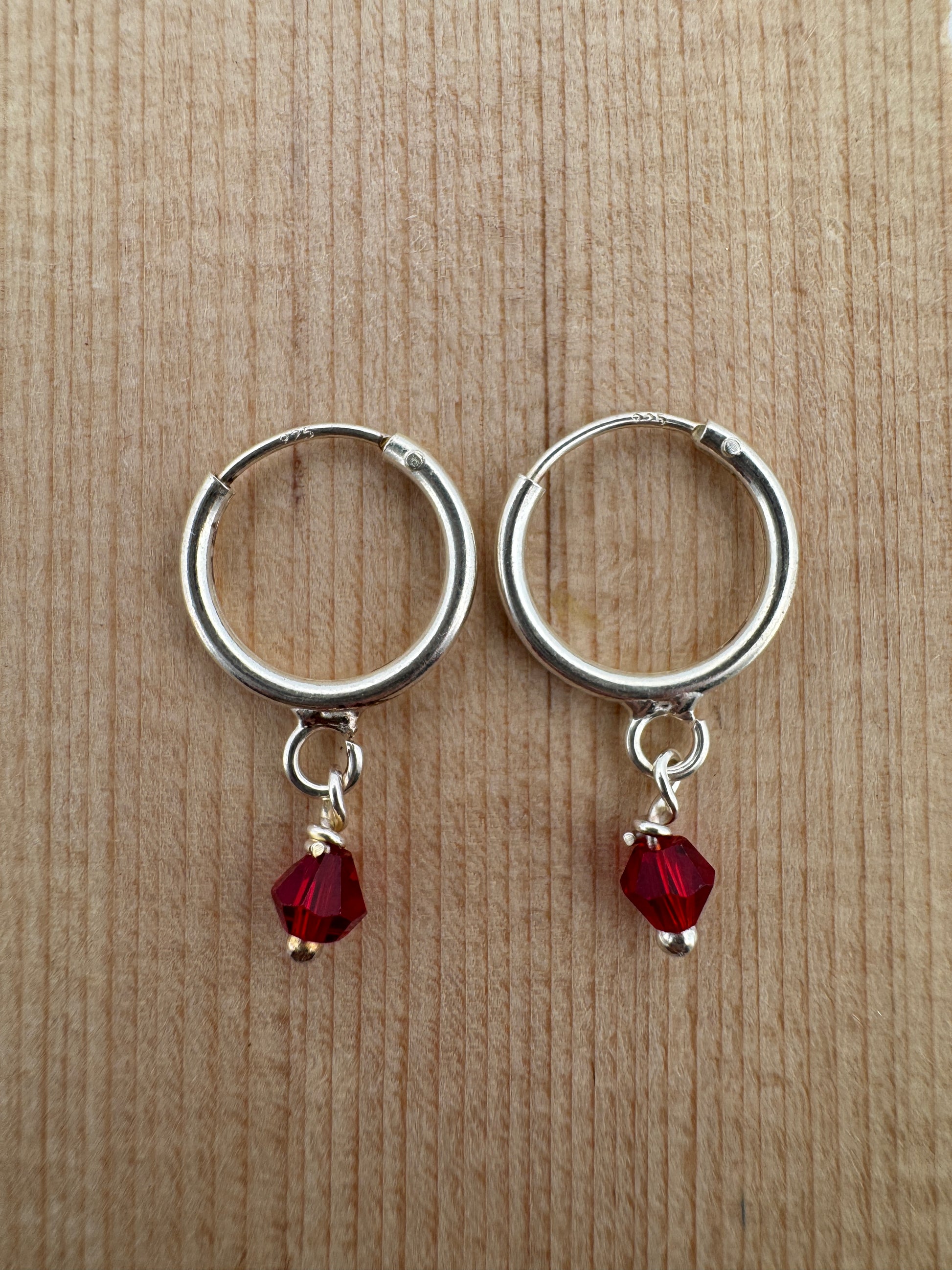 - "Handmade Hoop Earrings"
- "Ruby Crystal Jewelry"
- "Austrian Crystal Earrings"
- "Sterling Silver Jewelry"
- "Women's Hoop Earrings"