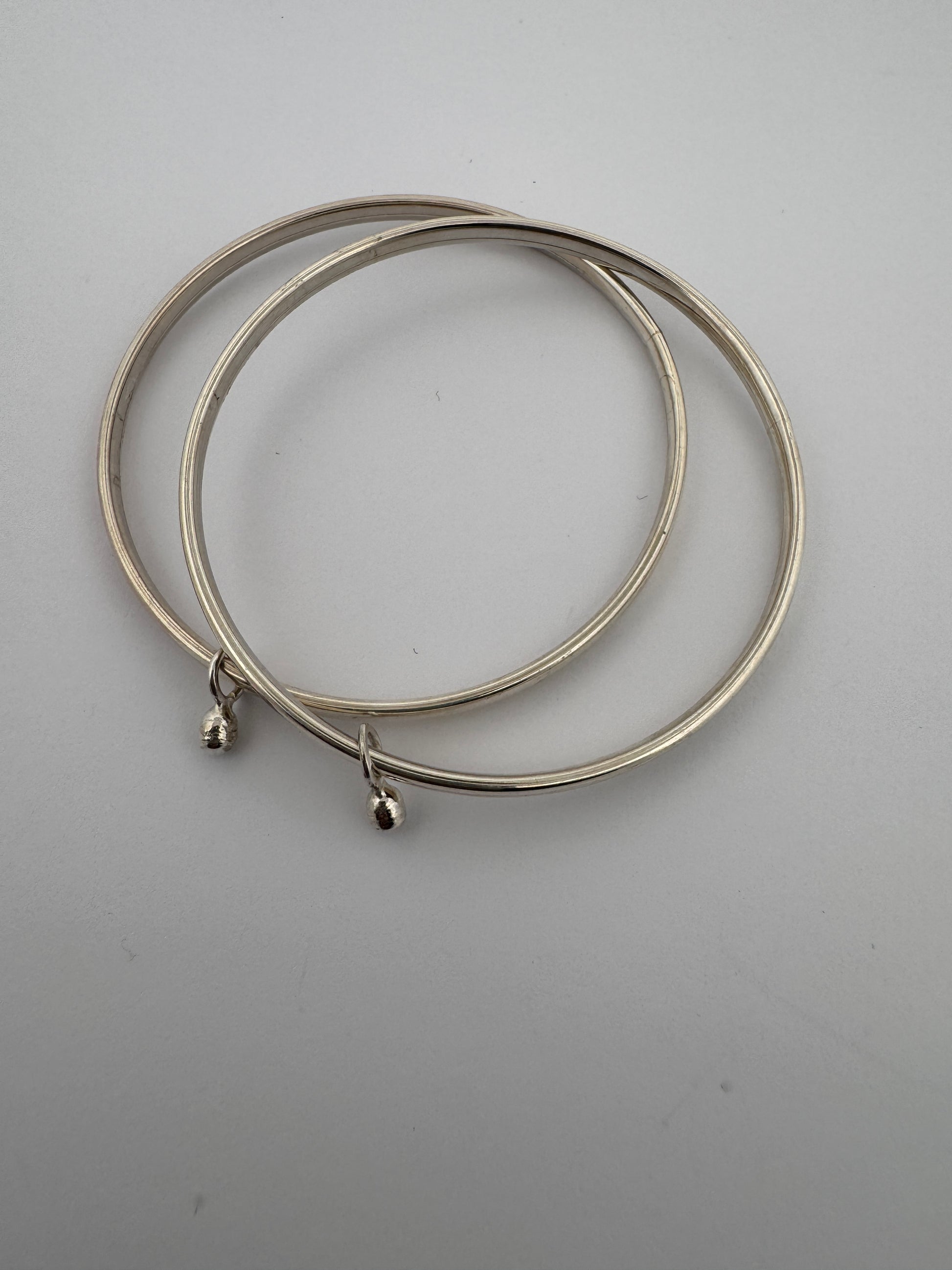 1. Sterling Silver Bangle with Soundless Anklets
2. Hinge Bangle Design
3. 925 Silver Bangle with Gumgarao
4. Elegant Hinge Bangle
5. Traditional Indian Bangle